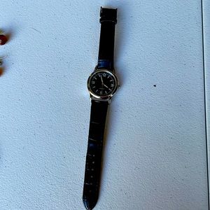 Watch with black leather band and black face